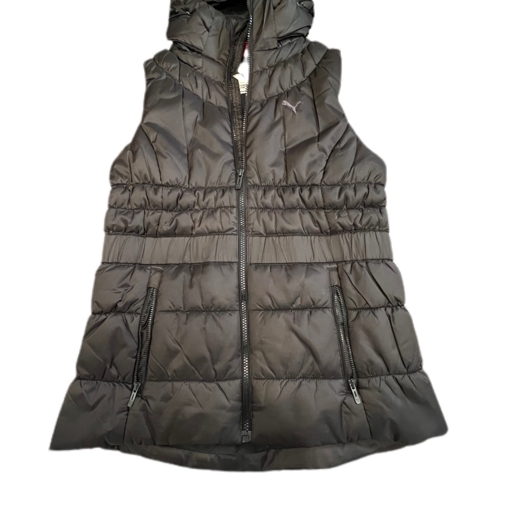 A used like new Puma Hooded insulated down vest Women Large Slim Fit.